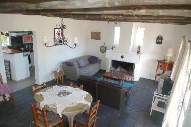 downstairs living-dining with fireplace & TV