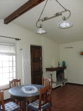 dining area and live flame fireplace
