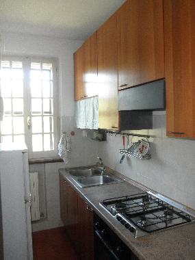 separate kitchen with hob/oven and fridge/freezer