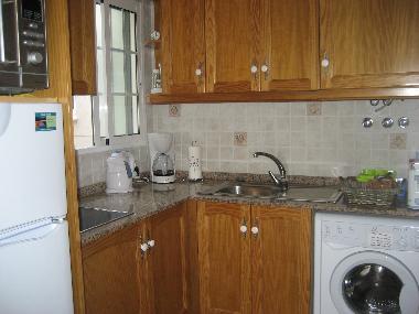 Kitchen with fridge-freezer and washing machine