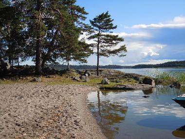 Nearby childrens beach with nice cliffs next to them.