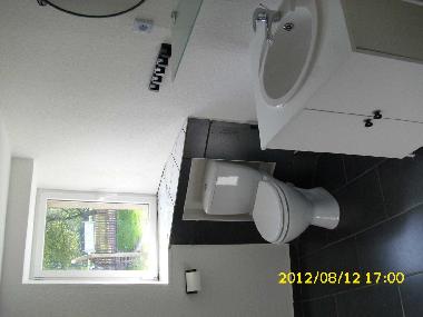 Modernised bathroom with shower.