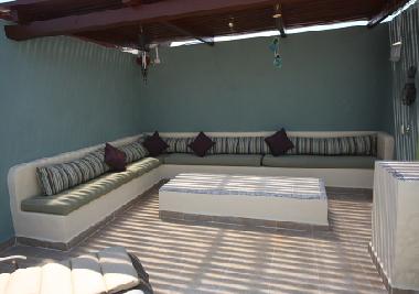 Entertain in shaded rooftop comfort 