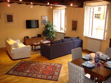 Spacious living room with large sofa bed