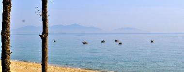 Morning view of fishing boats on An Bang Beach