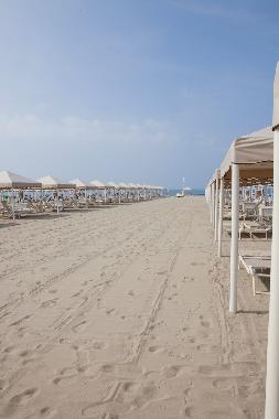 directly on the  sandy beach. The teints on the beach