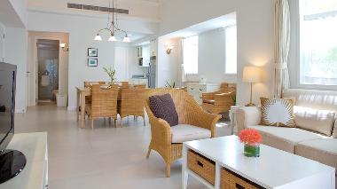 Open space living and dining area with fully equipped kitchen.