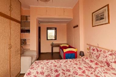 Pink room with baby cot