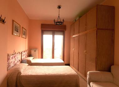 Pink room with two single bed