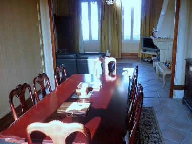Dining room, seats 10, armoire with board games.