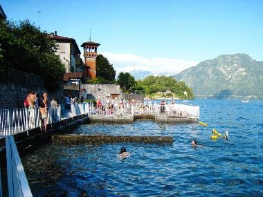 View of the beach and enclosed swimming area set into the lake just 30 meters from the apartment