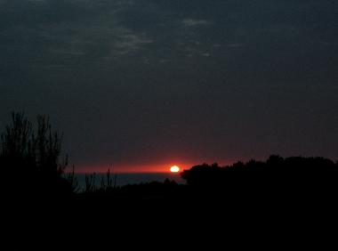 Sunset view over the ocean by swimming pool