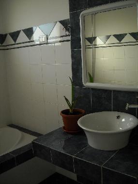 Bathroom with shower and tub.