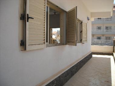 The terrace on the right side of the apartment leads to the bedroom with its own sliding door.