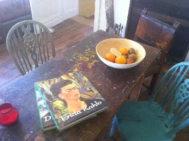 Artists table that has been upcycled to seat 10 comfortably for dinner 