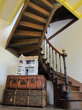 Spiral staircase from dining room onto first floor