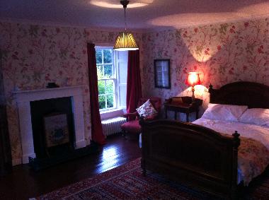 The 'pink' bedroom with views into the garden and the park