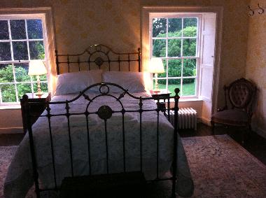 The master bedroom (en suite - bath) with views of the mountains