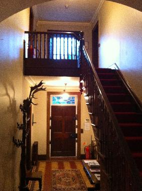 The hallway, left the music/sitting room, right the dining room 