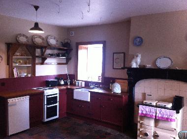 The farmhouse kitchen with all mod cons, views into yard