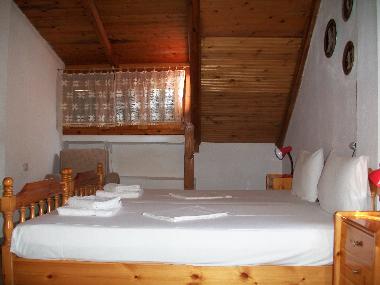 Upper floor room with two single beds