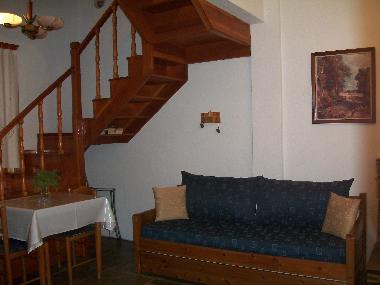 Couch in living room that can be converted to single or double bed