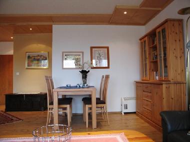 dining table with chairs in the living room