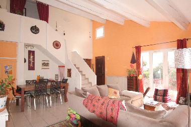 another view of living room with stairs to second floor