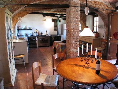 Dining table, in the back the kitchen