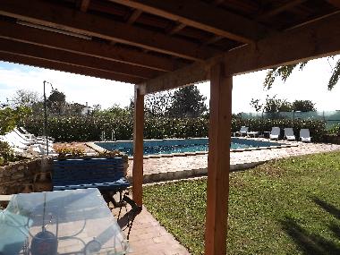 Outside barbecue area with tables and chairs.