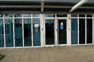 The front of the building - the main entry door with the concierge behind.