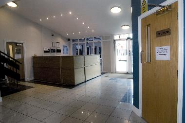 Main hallway - gym complex, sauna and steam room to the left and the mail room to the right.