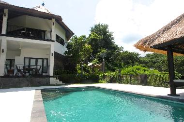 Surrounded by terrace and tropical garden