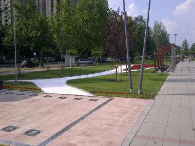 In front of the building, on Danube bank