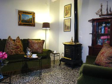 The comfortable sitting room features traditional seating incorporating double sofa-bed