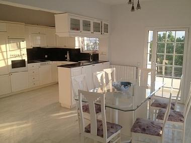 Kitchen & Dining room has all the usual requirements and a seating area for 8 people