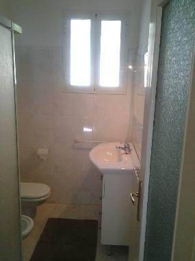 bathroom with shower, bidet and toilet