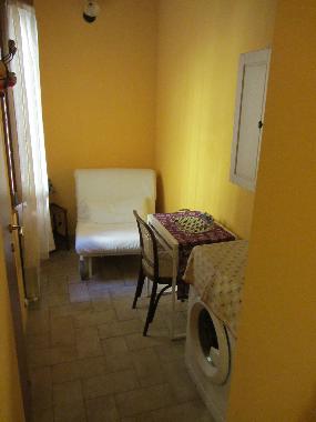 room with table, 2 chairs and washinh machine
