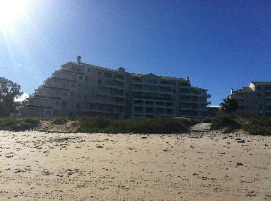 VIEW OF BUILDING FROM BEACH