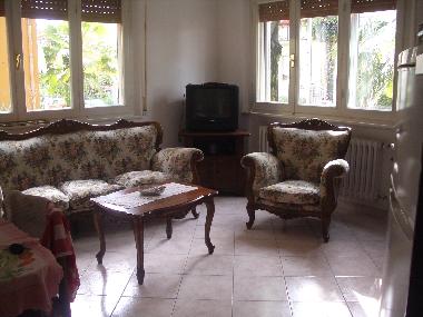 dining room, the kitchen is opposite the sofa