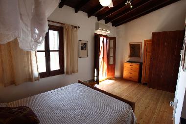 Master bedroom with door to balcony