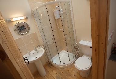 The en-suite shower room belongs to the double bedroom