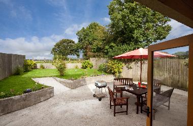 The garden is perfect for alfresco dining an allows children to play safely