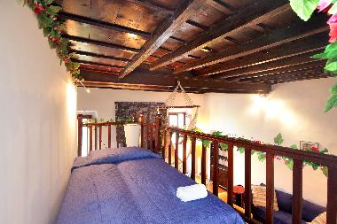 a single bed on the loft