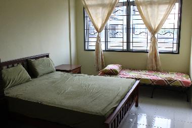 Master bedroom, sleeps 3 with attached bathroom and view of the garden and the sea