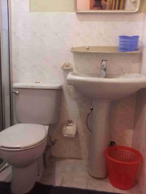 Toilet/ Bath with a shower