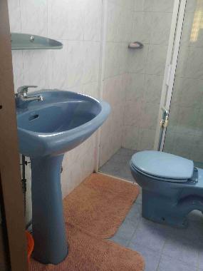 Toilet/ Bath with a shower