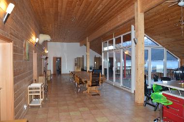 largeliving and dining area overlooking the fjord