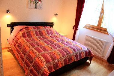 Double bed in the 1st bedroom