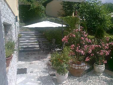 terrace infront of the apartment with table & chairs